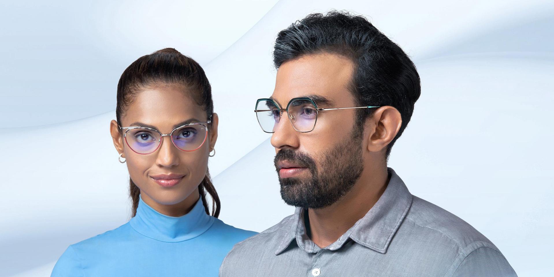 A middle-aged women and man wearing ZEISS Progressive Light 2 lenses.