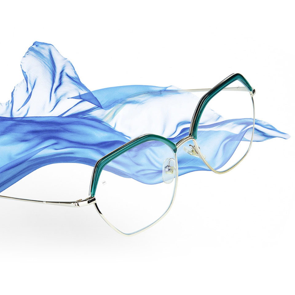 An image of eyeglasses with ZEISS Progressive Light 2 lenses and a blue cloth floating in the air.