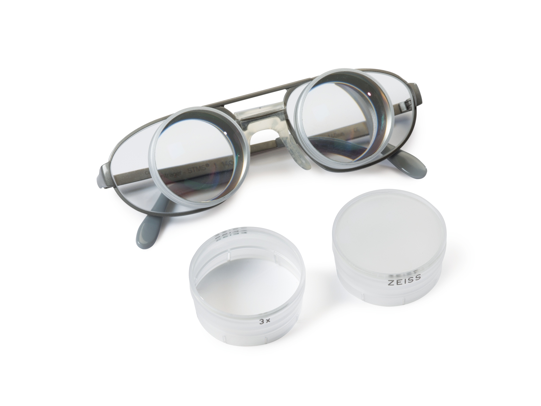 Regular spectacles frame with Galilean teleloupe attached directly onto the lenses.